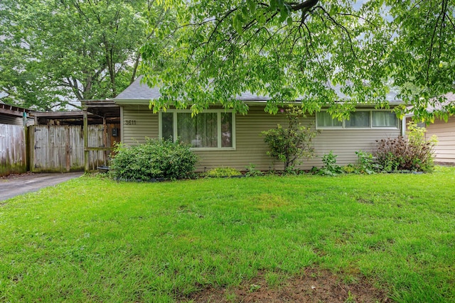3611 Gerbert Rd, Columbus, OH 43224 - view of front facade featuring driveway and an attached carport