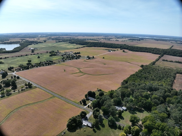 birds eye view of property with a rural view and a water view