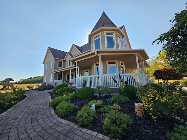 victorian house featuring a porch