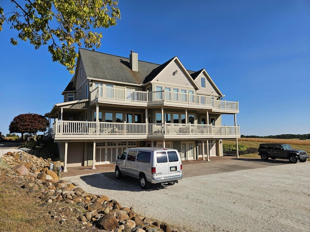 back of house with a balcony