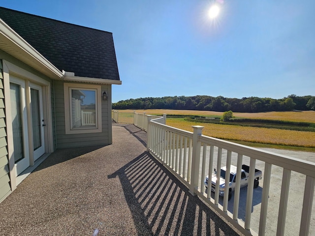 balcony featuring a rural view