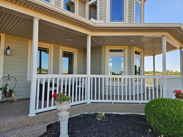 property entrance with covered porch