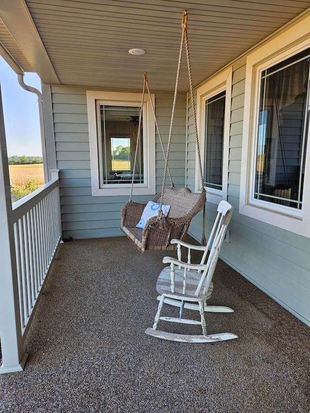 view of patio featuring a balcony