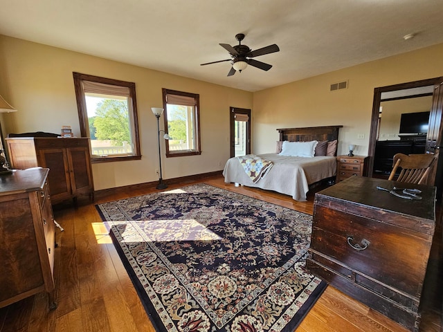 bedroom featuring ceiling fan and hardwood / wood-style flooring