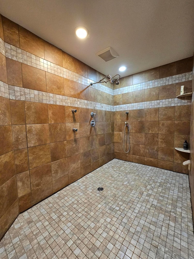 bathroom with a tile shower