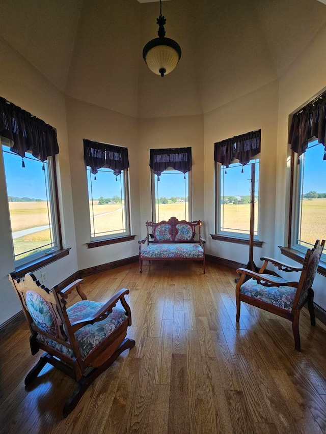 sunroom with a healthy amount of sunlight and lofted ceiling