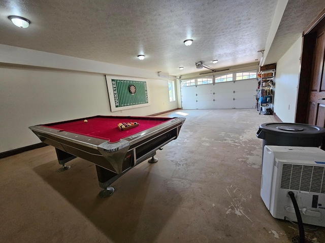 rec room featuring concrete flooring, a textured ceiling, and pool table