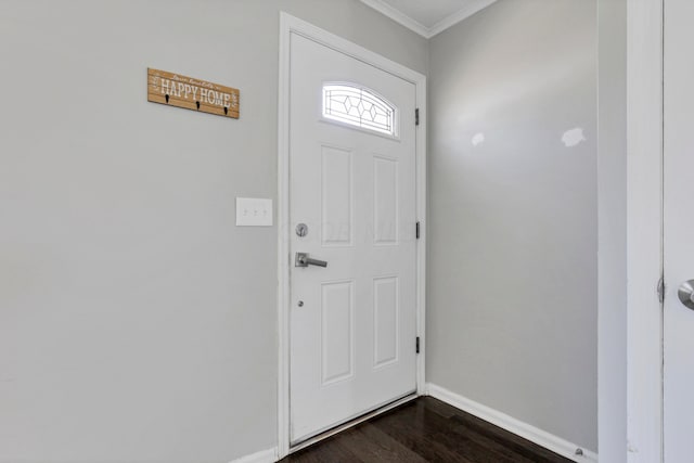 entrance foyer featuring crown molding and dark wood-type flooring