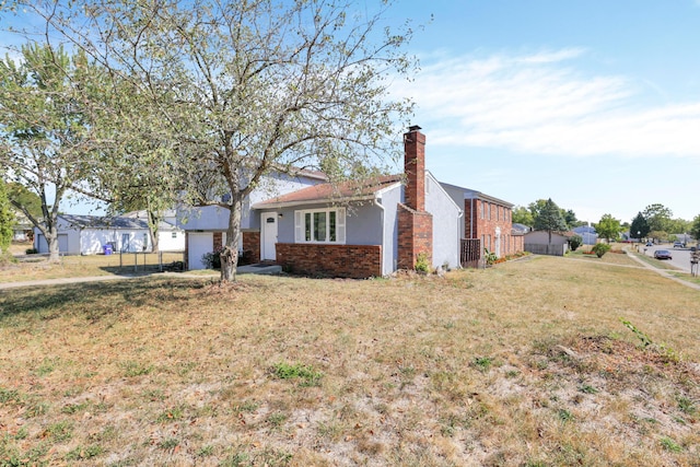 view of front of home with a front yard