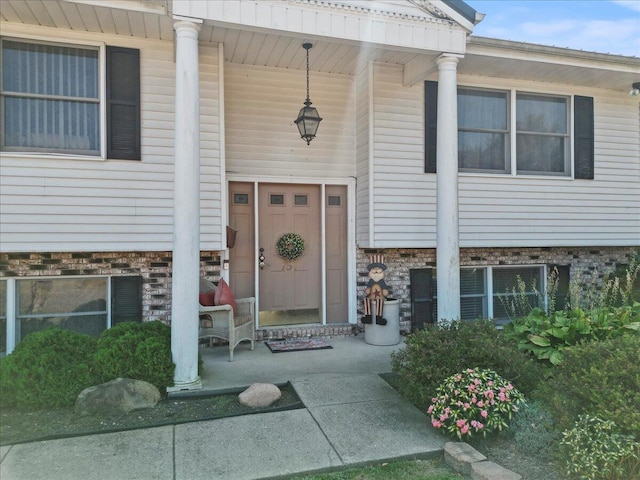 doorway to property with covered porch