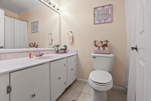 bathroom featuring toilet, tile patterned flooring, vanity, and ornamental molding