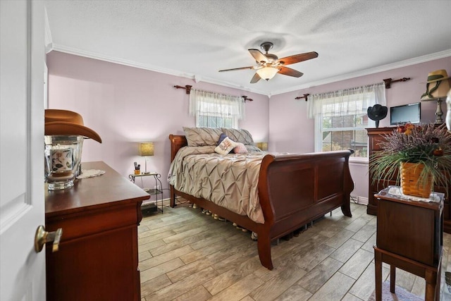 bedroom featuring baseboards, ceiling fan, wood tiled floor, a textured ceiling, and crown molding