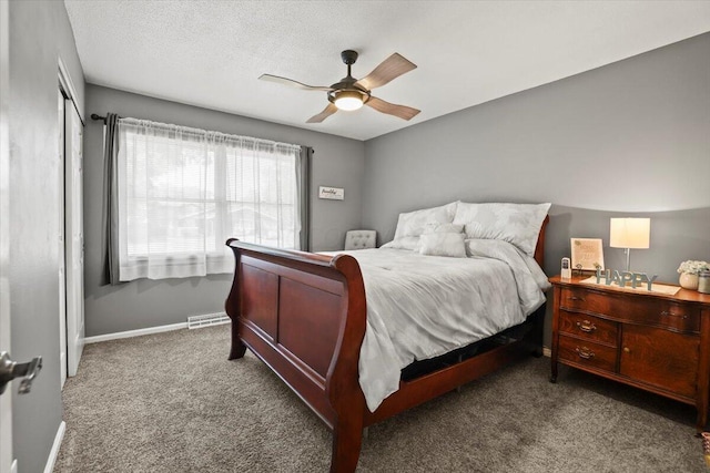 bedroom featuring ceiling fan and carpet