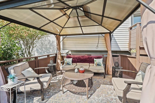 view of patio featuring an outdoor hangout area and a gazebo