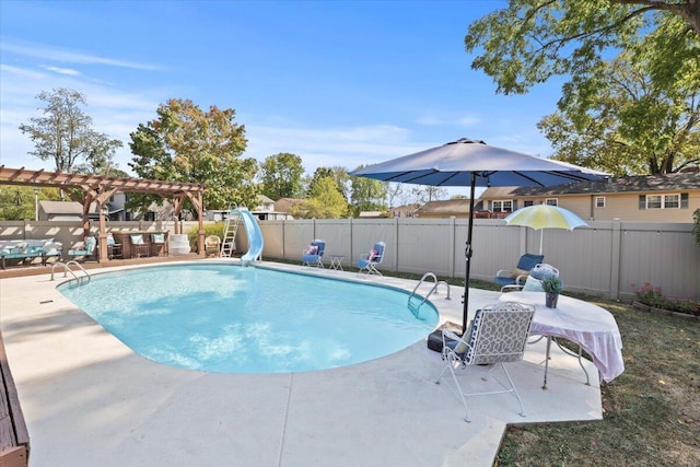 view of swimming pool featuring a pergola, a patio, and a water slide