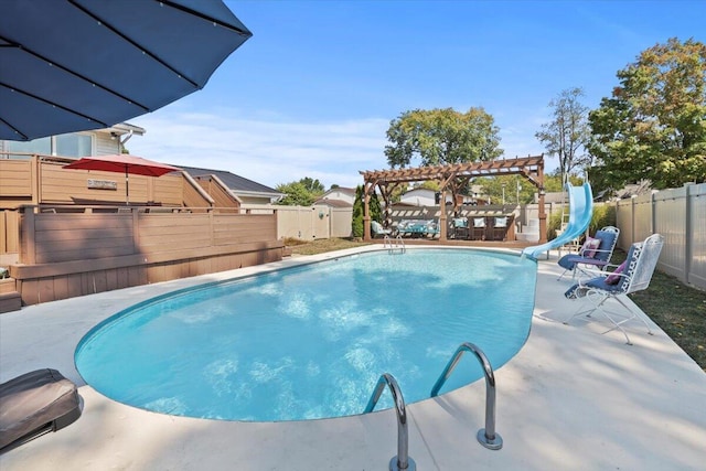 view of swimming pool with a pergola, a patio, and a water slide