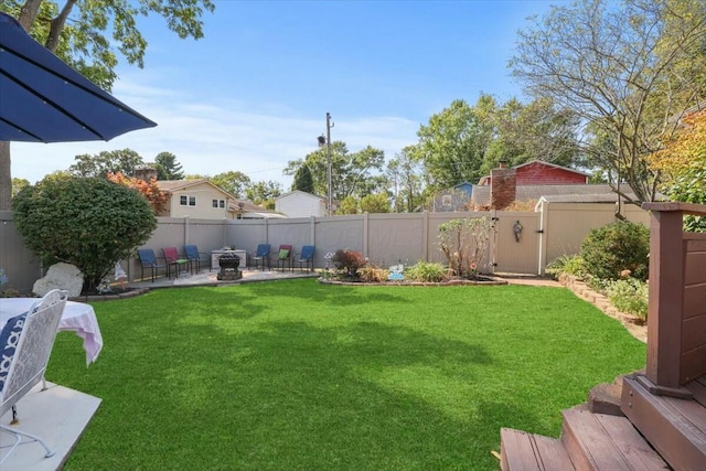 view of yard featuring fence private yard, a fire pit, and a patio