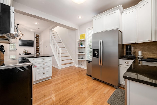 kitchen featuring decorative backsplash, white cabinetry, stainless steel fridge with ice dispenser, and light hardwood / wood-style flooring