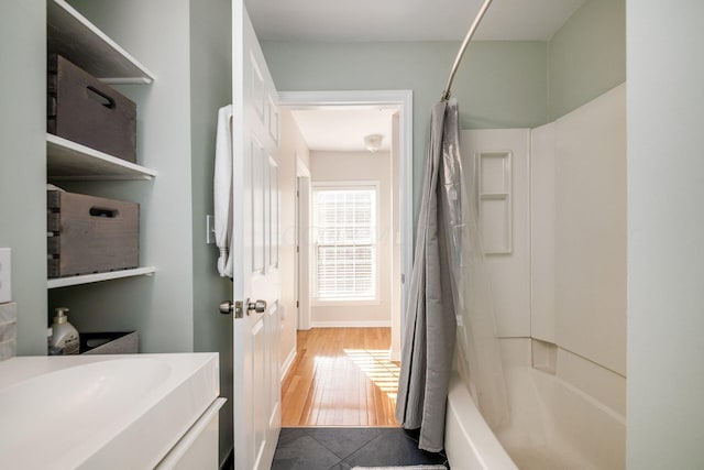 bathroom featuring vanity, shower / bath combination with curtain, and hardwood / wood-style flooring