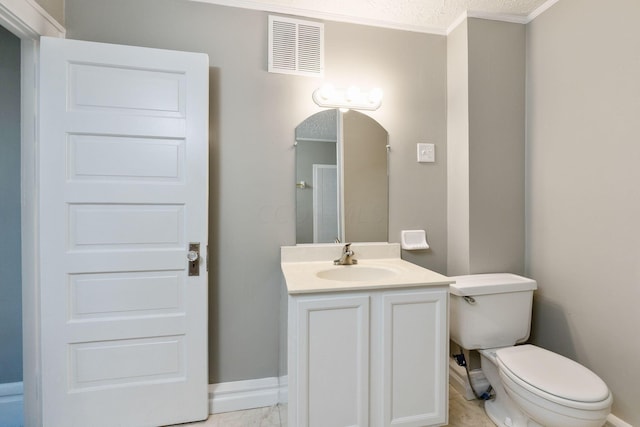 bathroom with toilet, vanity, a textured ceiling, and ornamental molding