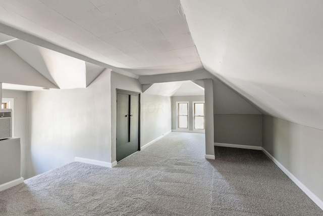 bonus room featuring carpet floors and lofted ceiling