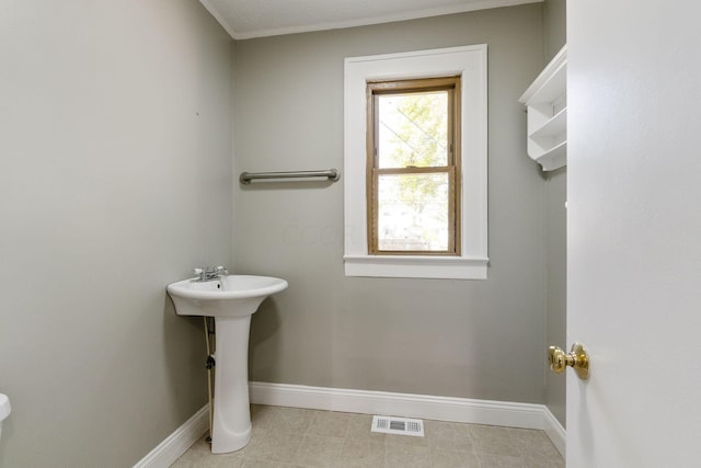 bathroom with tile patterned flooring and sink