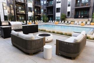 view of pool with grilling area