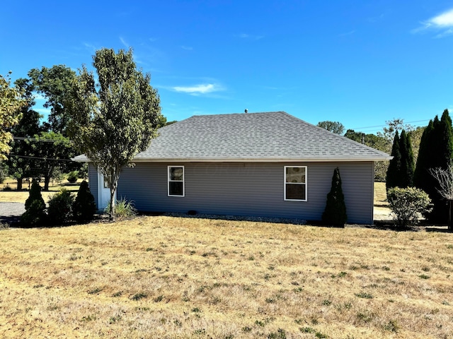 view of property exterior featuring a lawn