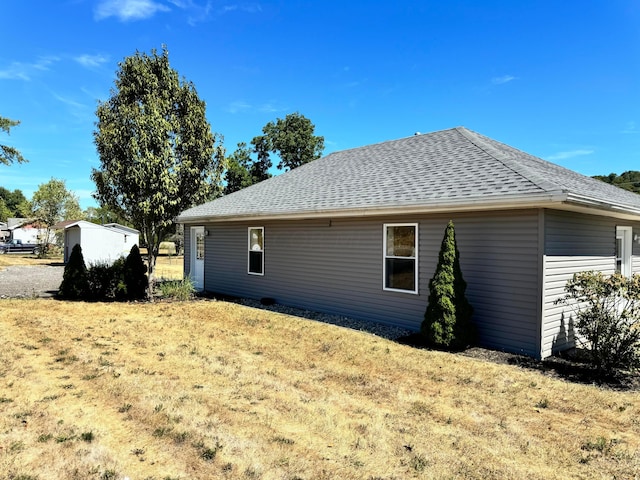 view of property exterior with a lawn