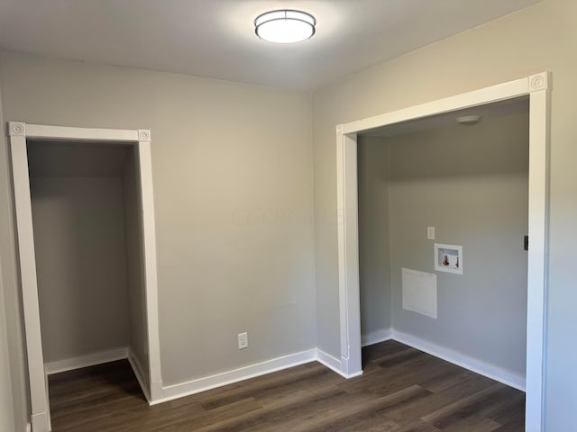 clothes washing area featuring dark wood-type flooring and washer hookup