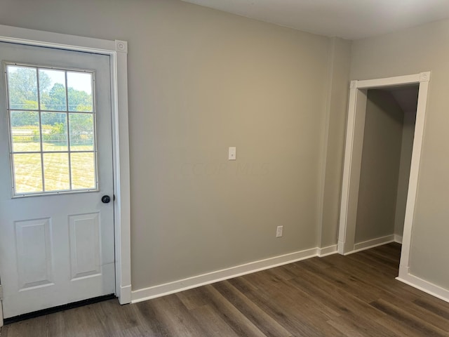 doorway to outside with dark wood-type flooring