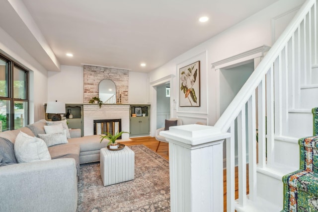 living room featuring hardwood / wood-style flooring and a fireplace