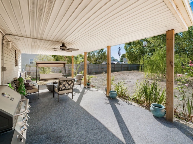 view of patio with an outdoor living space, ceiling fan, and grilling area