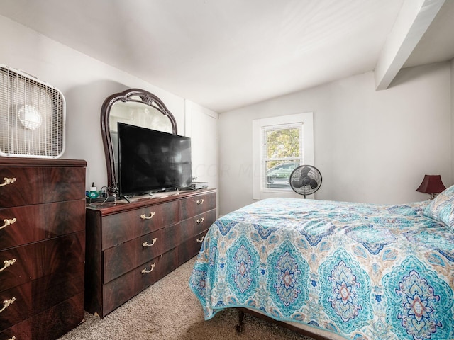 bedroom with carpet and lofted ceiling with beams