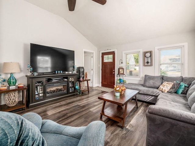 living room with ceiling fan, wood-type flooring, and vaulted ceiling