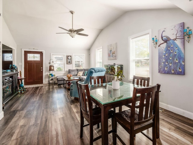 dining room featuring vaulted ceiling, ceiling fan, and dark hardwood / wood-style floors