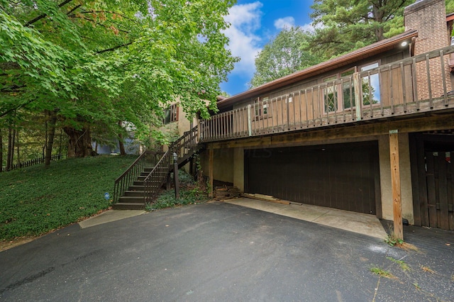 view of front of property with a garage and a front lawn