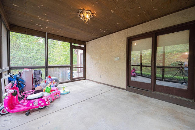 sunroom / solarium with wood ceiling