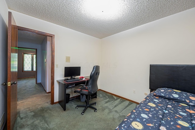 bedroom featuring carpet and a textured ceiling