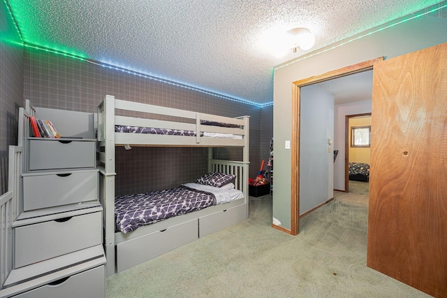 carpeted bedroom with a textured ceiling