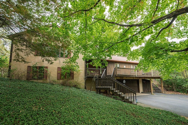 exterior space featuring a garage and a deck