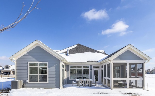 4843 Edison St, Hilliard, OH 43026 - snow covered rear of property with a sunroom, a patio area, and outdoor dining space