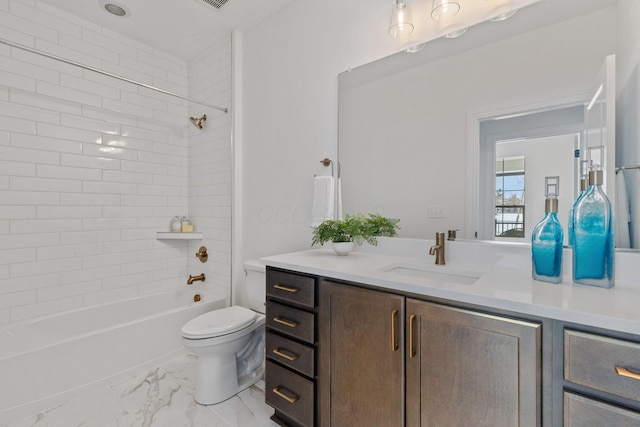 bathroom with marble finish floor, shower / washtub combination, vanity, and toilet