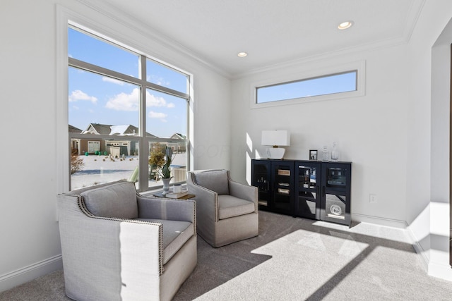 living area with carpet floors, baseboards, ornamental molding, and recessed lighting