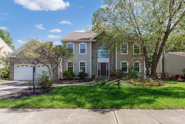 colonial inspired home featuring a garage and a front yard