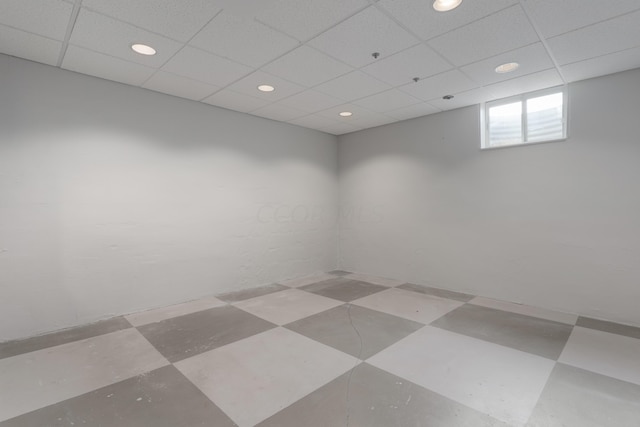 spare room featuring a paneled ceiling