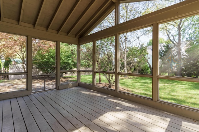 unfurnished sunroom with lofted ceiling