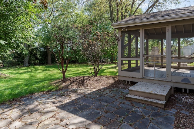 view of yard featuring a sunroom