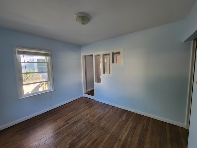 empty room featuring dark hardwood / wood-style floors