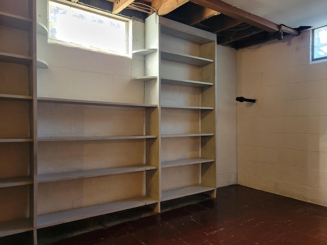 859 Gladden Rd, Grandview Heights, OH 43212 - basement featuring concrete block wall and dark wood-style floors